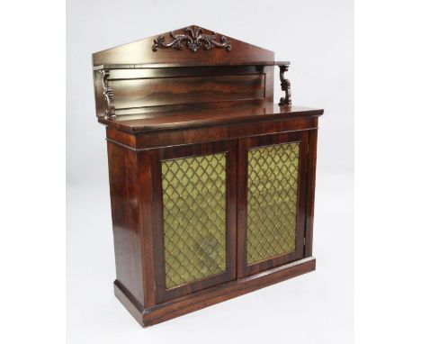 A Victorian rosewood chiffonier, the architectural back with single shelf above two brass grill doors, W.3ft 6in.