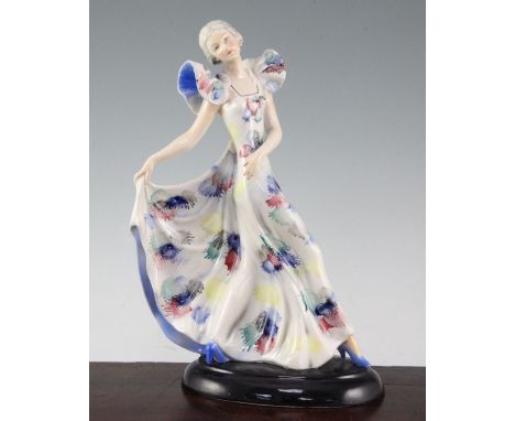 A W. Goebel Art Deco figure of a lady, 1930's, the dancing figure holding one pleat of her polychrome splashed dress, on a bl