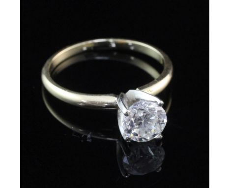 A 14ct gold and solitaire diamond ring, the round brilliant cut stone weighing approximately 1.00ct, size M.