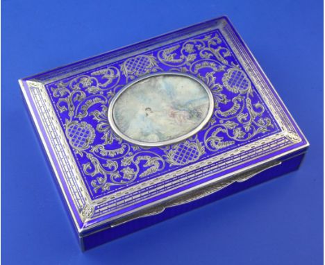 A 1920's Austrian 935 standard silver and blue guilloche enamel rectangular trinket box, the lis with inlaid silver scrolling