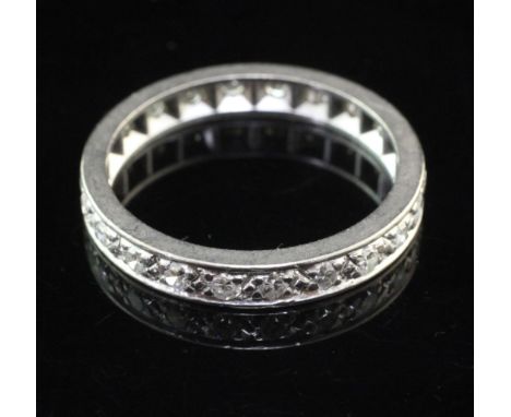 A platinum and diamond full eternity ring, set with twenty two round cut diamonds, size Q.