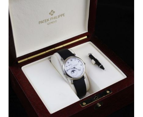 A gentleman's 18ct white gold Patek Philippe 'Officer's' wrist watch, model 5054G-001, the white enamelled dial with subsidia