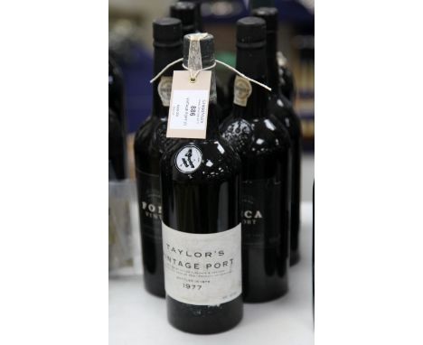 Seven assorted bottles of vintage port including one Taylor 1977, into neck; two Fonseca 1985; one Graham 1991; one Warre 199
