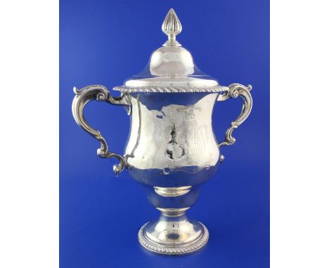 A George III silver two handled cup and cover by Daniel Smith & Robert Sharp, of baluster form, with ornate engraved armorial