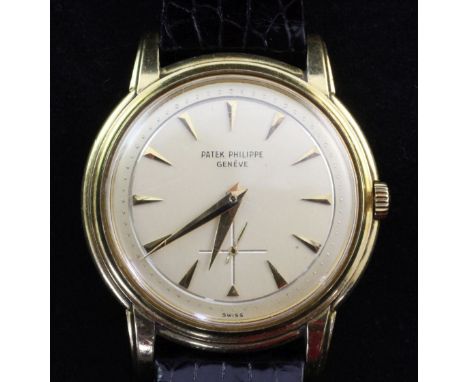 A gentleman's 1950's 18ct gold Patek Philippe Calatrava manual wind wristwatch, with arrowed baton numerals and subsidiary se