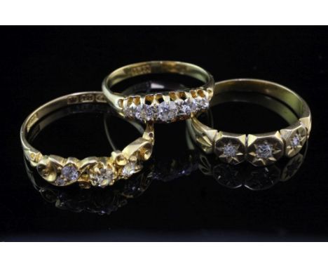 Three late 19th/early 20th century 18ct gold and diamond set rings, of various designs, gross weight 8.9 grams, sizes M,P & S
