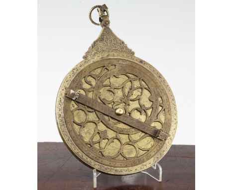 A Persian engraved brass astrolabe, probably 19th century, with pierced dials and engraved scale indicators, 6in.