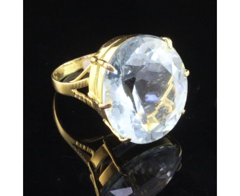 A 14ct gold and aquamarine dress ring, the fancy oval cut stone weighing approximately 25.00ct, size Q.