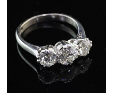 A modern 18ct white and three stone diamond ring, the three old cut stones with an approximate total weight of 2.65ct, size O