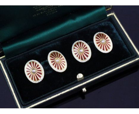 A pair of early 20th century 18ct gold, two colour enamel and seed pearl set cufflinks, of oval form, with starburst decorati
