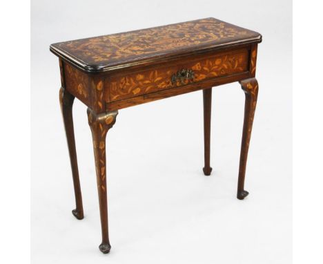 An 18th century Dutch oak and marquetry inlaid folding card table, the hinged top opening to reveal a chessboard interior, wi