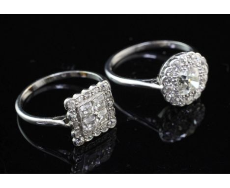 Two 1920's/1930's diamond cluster rings, circular form set in platinum and tablet form in a white metal setting, sizes L & J 