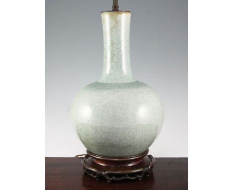 A Chinese celadon crackle-glaze bottle vase, mounted as a lamp, 20th century, with Chinese hardwood base, height 41cm to rim 