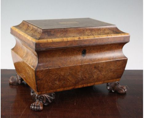 A 19th century rectangular burr yew wood two division tea caddy, the top inlaid with a central panel decorated with the words