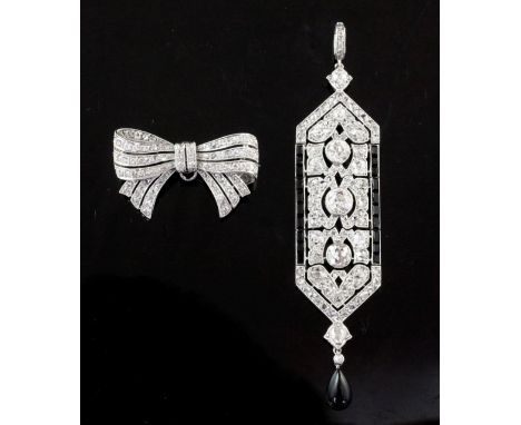 An attractive 1920's Cartier, platinum, diamond and black onyx drop pendant, of articulated elongated hexagonal design, with 