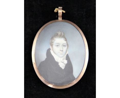 Early 19th century English Schooloil on ivory,Miniature portrait of a gentleman in a black coat, with hairwork back monogramm