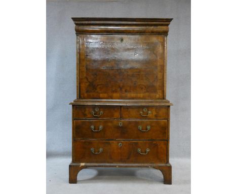 An early Georgian burr walnut crossbanded and herringbone strung escritoire with convex frieze drawer to the upper section ab