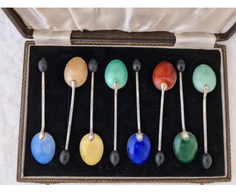 Set of 8 silver and enamel bean topped coffee spoons in fitted case. Birmingham 1948