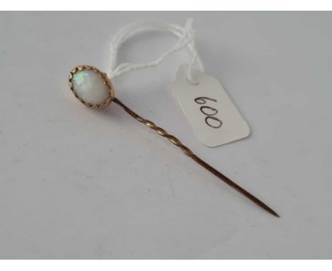 A gold an opal stick pin