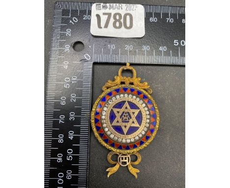 An Antique silver gilt enamel and paste pendent