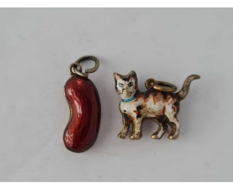 A red enamel bean and cat charms