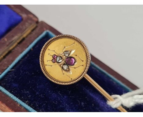 A cased gold stick pin with diamond &amp; ruby stones in the form of a bee