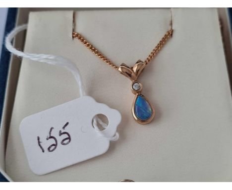 A boxed opal &amp; diamond pendant necklace in 9ct 20” long 3.7g inc