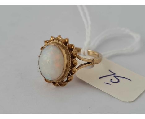 A single stone opal ring in 9ct size K