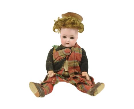An early 20th Century German Simon &amp; Halbig bisque headed doll. Brown flirty eyes, finely painted brows and lashes, open 