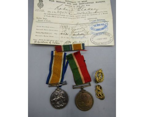 1914 war medal and Merchant Marine Medal to R. Blakey with ribbons and authority (local to Downham Mkt) and 2 Naval badges