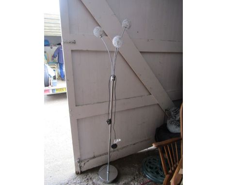 A standard lamp with 3 branch light