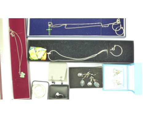 A collection of silver jewellery, four pendants, earrings (4), a ring and a brooch