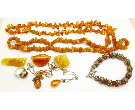 Amber jewellery; 2 necklaces, 2 silver and amber pendants, 3 brooches, a ring and a white metal mounted bracelet 
