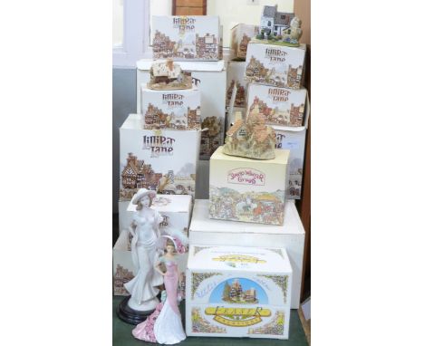 A collection of sixteen Lilliput Lane model cottages, two David Winter cottages and one Fraser Creations, (plus one empty LL 