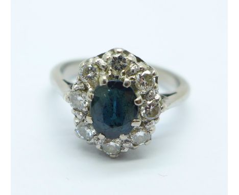 An 18ct white gold, diamond and sapphire cluster ring, 5.9g, O 