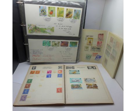 An album of First Day Covers and two stamp albums 