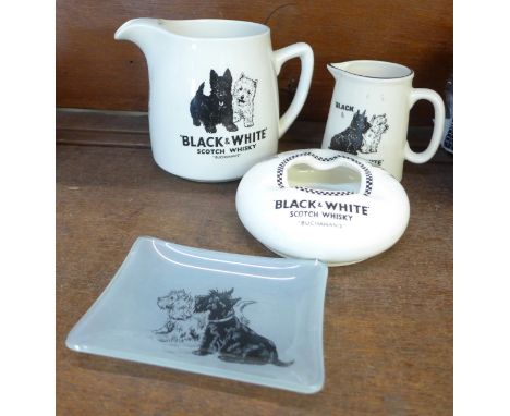 Black &amp; White Scotch Whisky jugs, an ashtray and a glass ashtray 