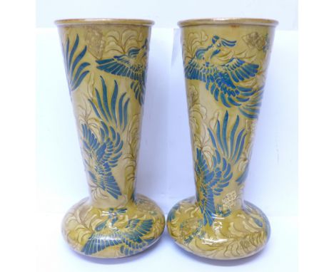 A pair of Doulton Lambeth Art Nouveau vases, circa 1890-1900, decorated with phoenix in foliage, A. Bentley mark to base, 22c