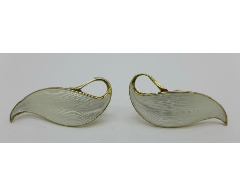 A pair of Norwegian silver gilt white enamel screw back earrings 