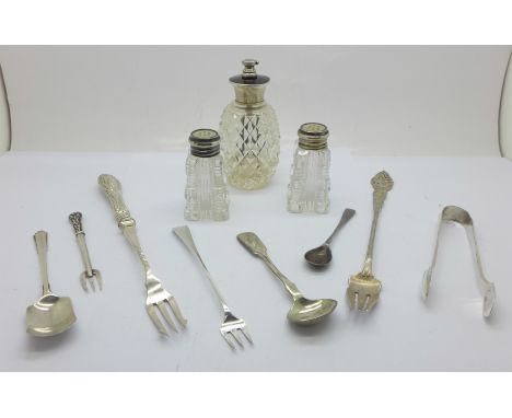 Three silver condiment servers, a sterling pickle fork, a pair of silver sugar bows, a Selfridge &amp; Co. perfume atomiser, 
