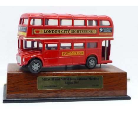A limited edition 114/240 red die-cast London Routefinder bus with musical movement playing Beatles Hey Jude when cranked, "a