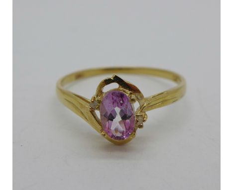 A 9ct gold, pink stone and diamond ring, 1.1g, O 