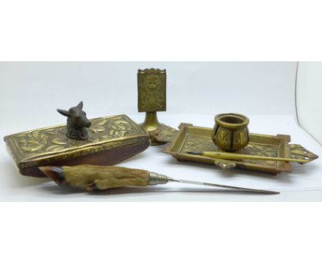 A brass inkwell, a brass blotter, a letter opener and match box holders 