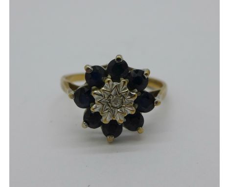 A 9ct gold, diamond and sapphire cluster ring, 2g, K 