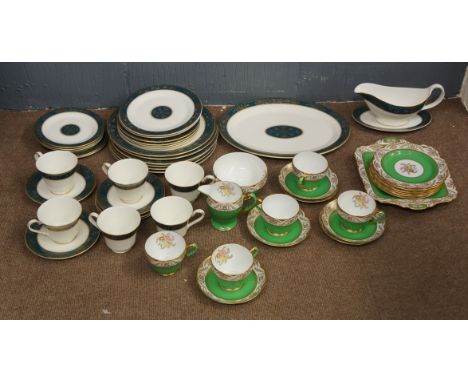 A Royal Doulton part dinner service, Carlyle pattern, bases marked; together with a Spode part tea service in green and white