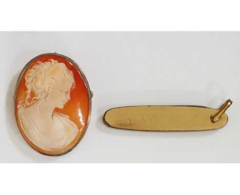 An oval shell cameo carved with a head and shoulder bust of a young lady, 4.4cm high x 3.2cm wide; an engine turned gold plat