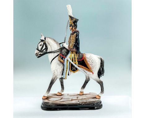 Limited edition hand painted fine china figure of a military gentleman in uniform on his horse. Gold accents throughout. Meta
