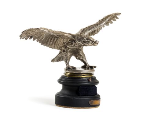 *Car mascot. A WWII period car mascot,  cast as a large eagle with outspread wings mounted on a radiator cap and turned wood 