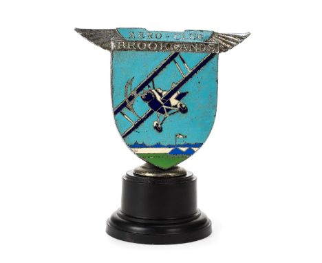 *Brooklands. A 1930s Brooklands Aero-Club Member's Badge by Spencer, London,  with bi-plane on a light blue, dark blue white 