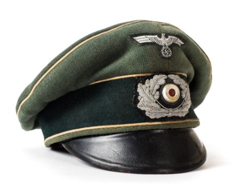 *Third Reich. A WWII German Army Officer's visor,  with cloth insignia and Wermacht eagle, green cloth with white piping, bla
